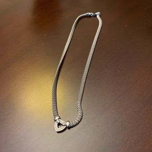 Very pretty silver and pave heart. Wears like a choker. New without tags.